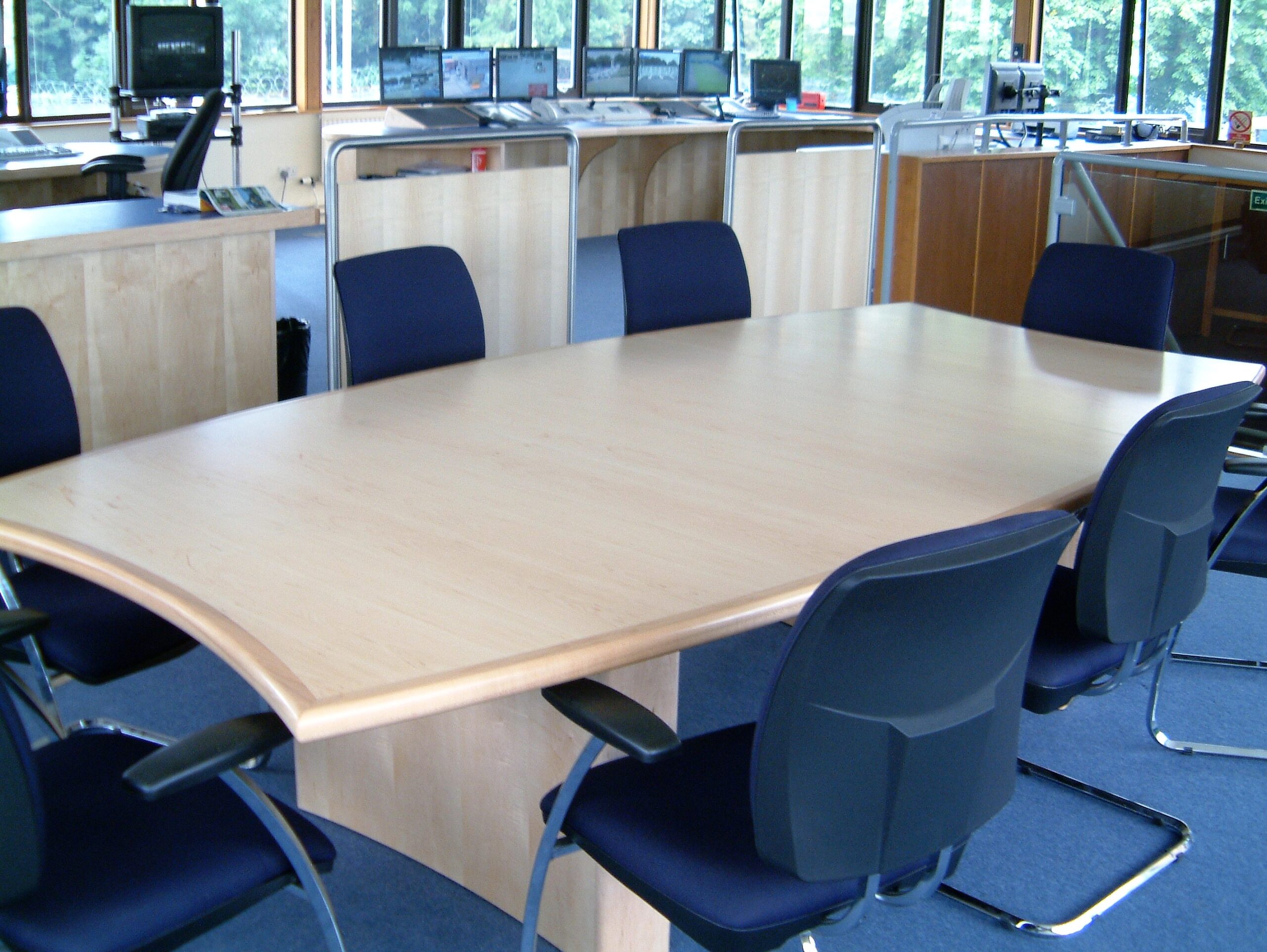 maple boardroom table with chairs inside office